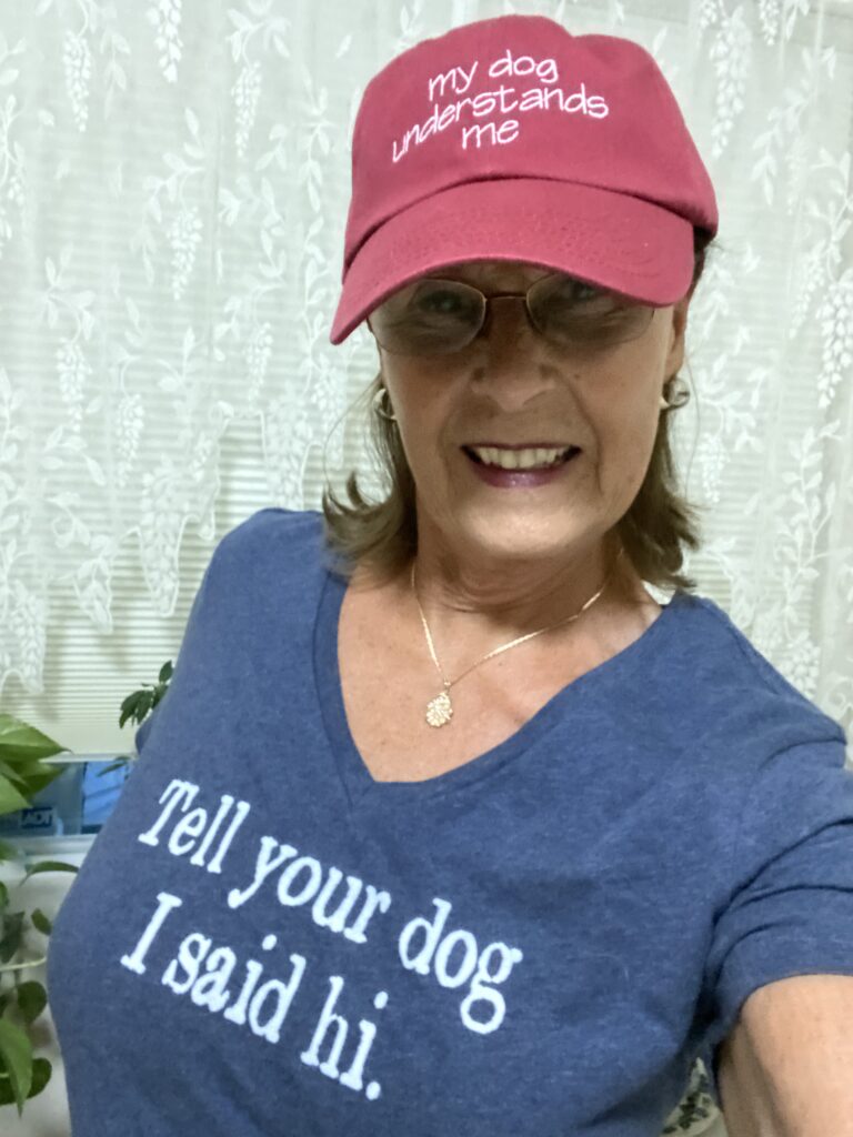 Barbara modeling T-shirt and hat by Tug Tees in Prescott, Arizona.